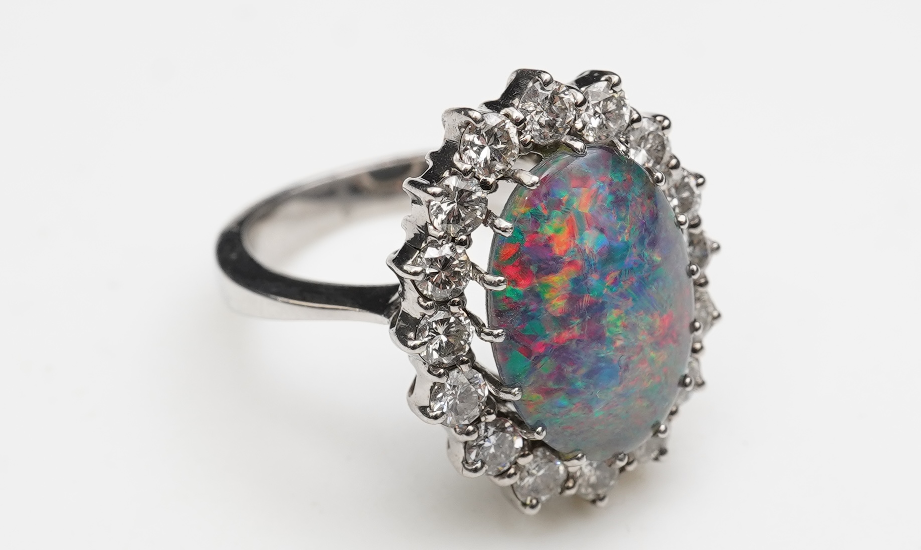 An opal triplet and diamond ring